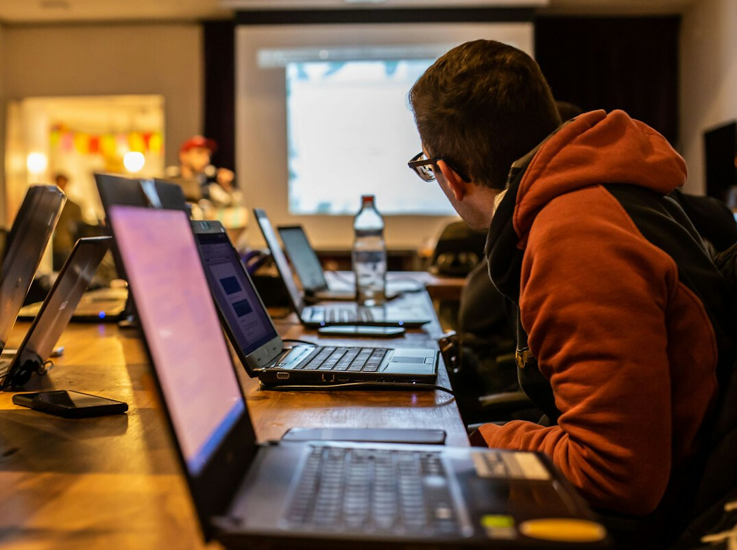 croatian student coding on laptop