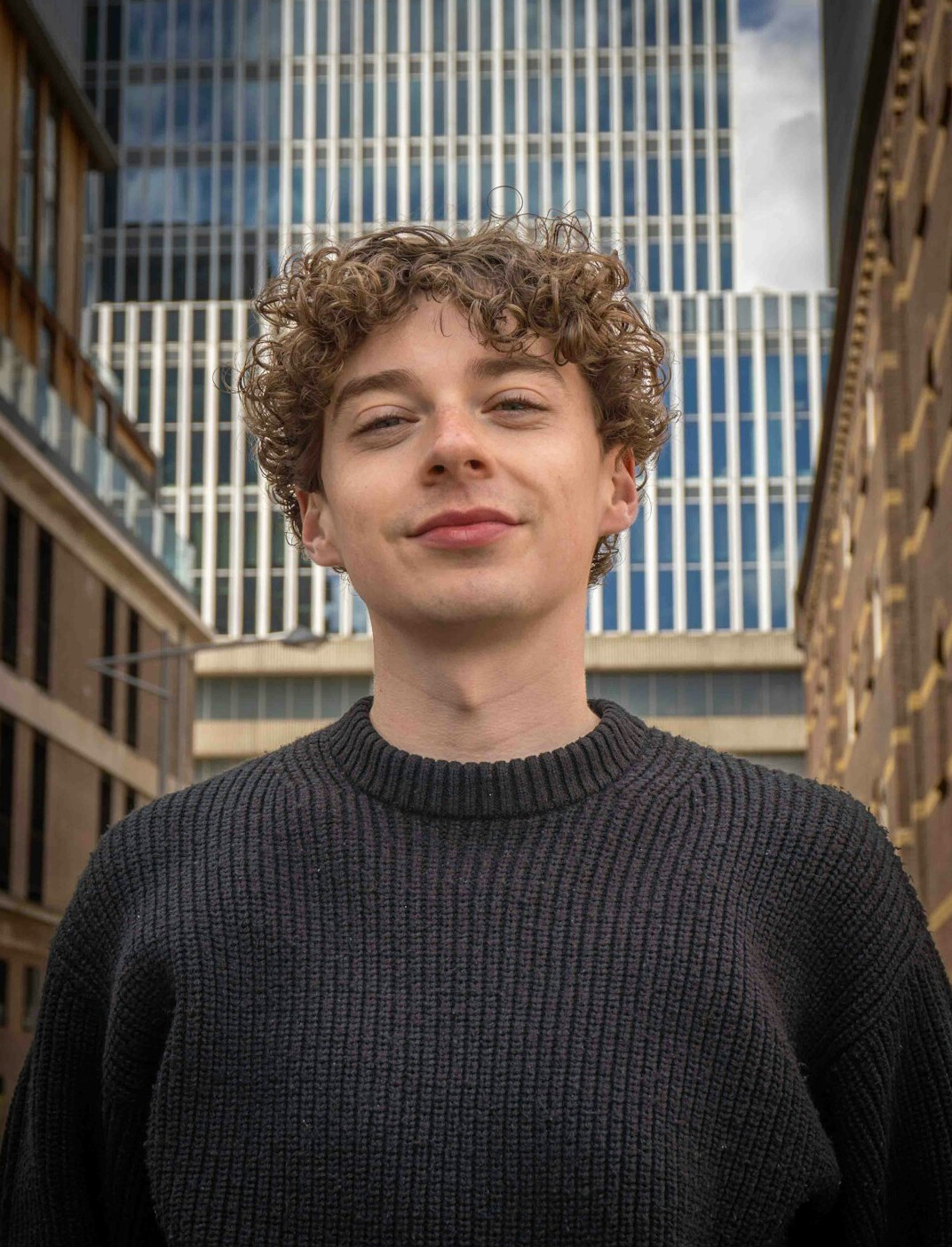 Portrait of a smiling man with short dark hair