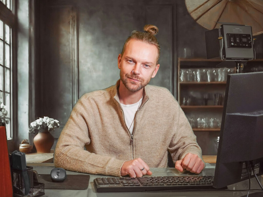 confident young programmer smiling