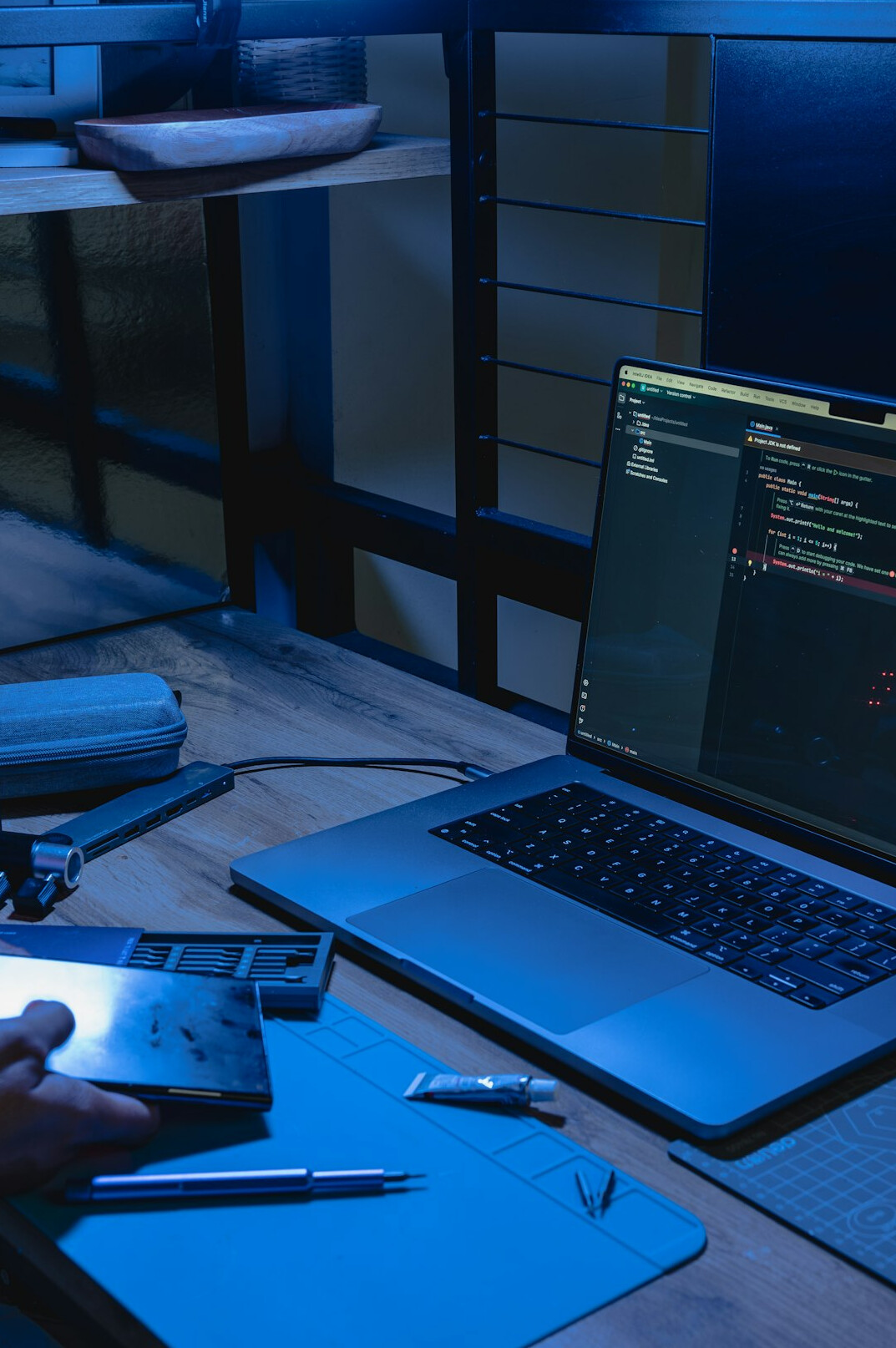 web developer coding on laptop